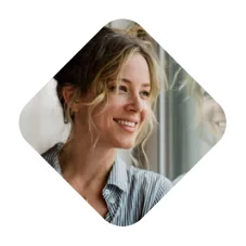 Woman smiling hopefully during her mental health recovery